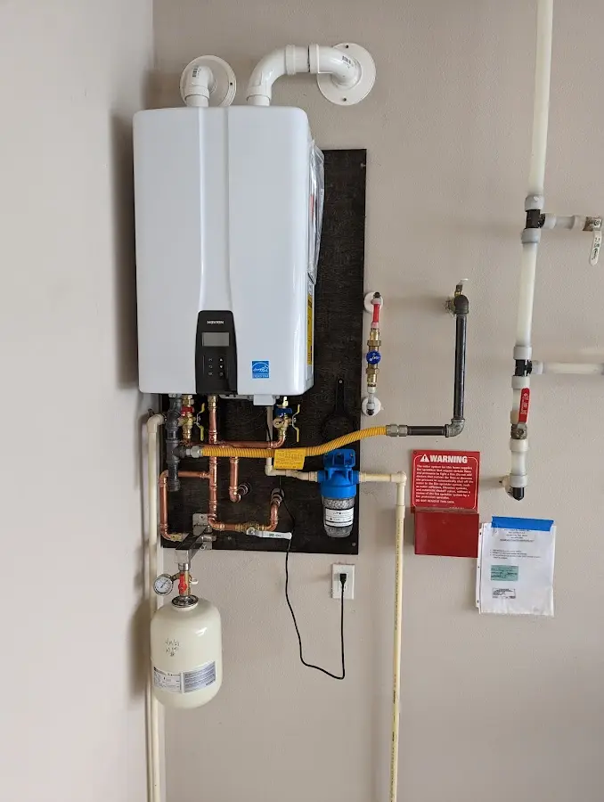 Professional plumber installing copper piping in a Bonner Springs home